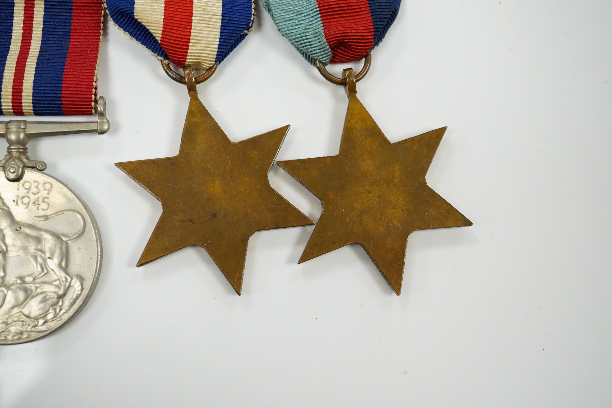 Seven military medals, including; a WWII medal group including the 1939-1945 Star, the France and Germany Star and the 1939-1945 Medal, a George V General Service Medal with a bar for Iraq awarded to GNR. G. Fuller R.A.